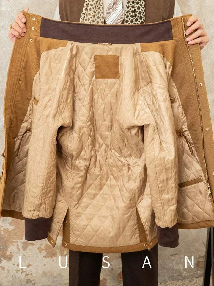 Mr. Lusan Jacket open showing camel outer fabric and quilted inner lining with pockets and ribbed cuffs for warmth and style