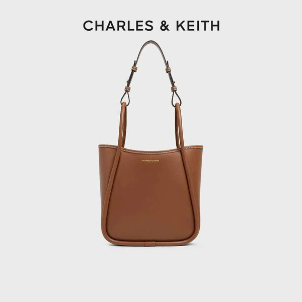 brown CHARLES & KEITH shoulder bag with adjustable straps and minimalist design