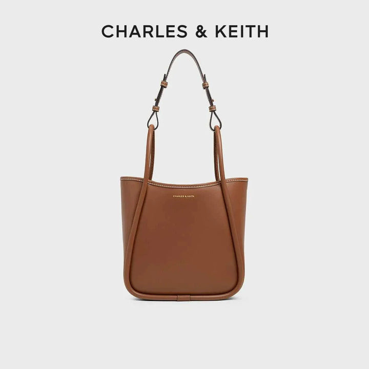 brown CHARLES & KEITH shoulder bag with adjustable straps and minimalist design