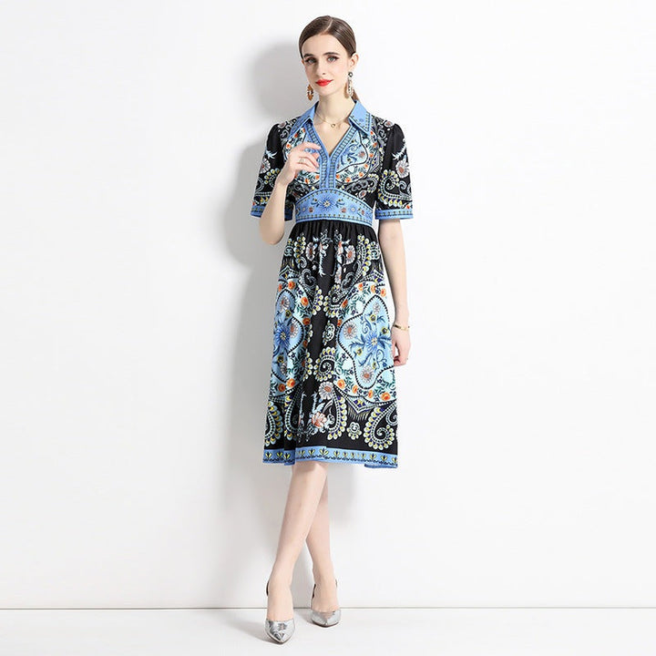 Elegant black dress with blue geometric patterns and classic collar for 2023 summer.