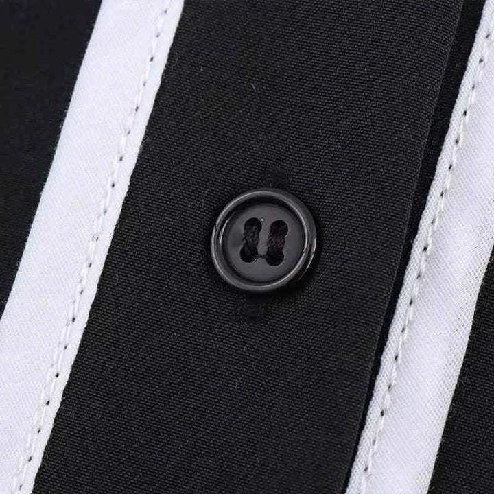 Close-up of black button on black and white contrast fabric from Summer 2025 women's retro shirt and pants suit
