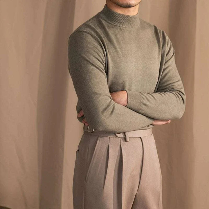 Mr. Lu San's 30% wool half-high neck slim fit sweater in beige worn with dress pants