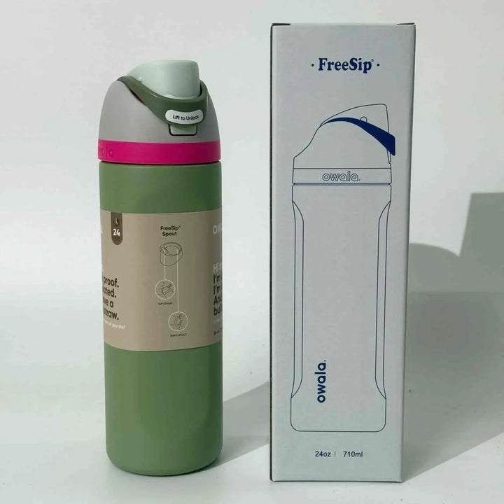 Owala FreeSip stainless steel water bottle with dual spout, leak-proof design, and 24-hour insulation in green color with packaging box