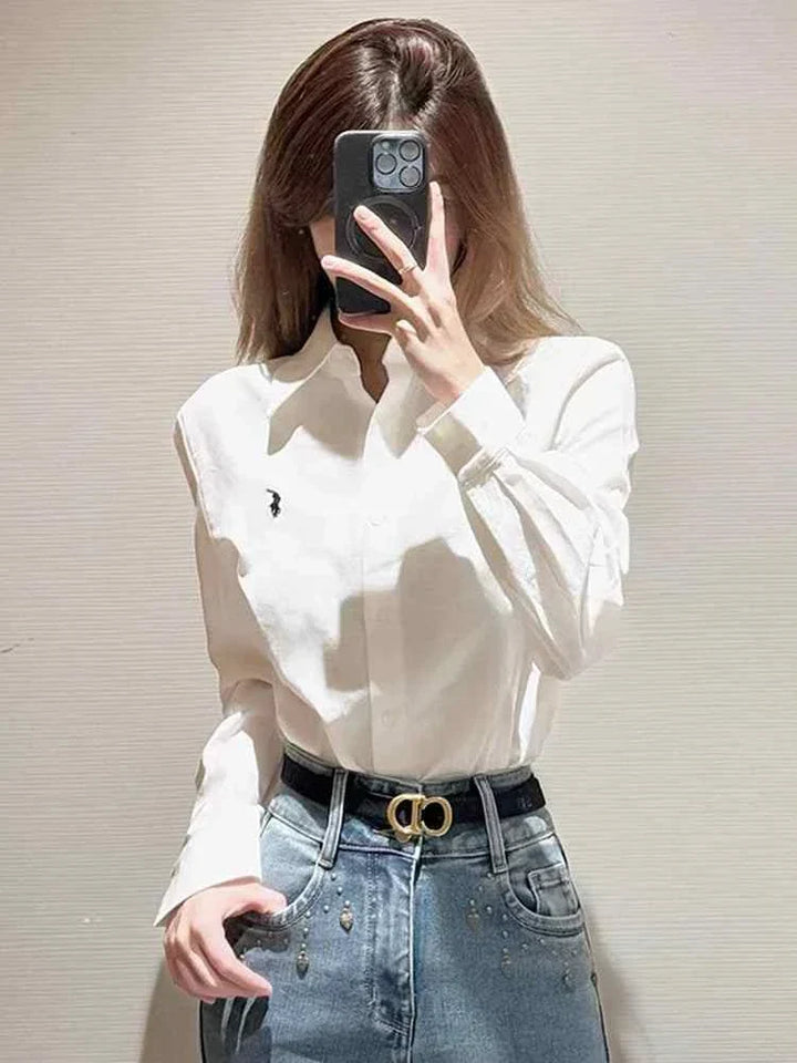 white slim fit polo La Chapelle shirt made of 100% cotton, medium length, unisex style, paired with blue jeans