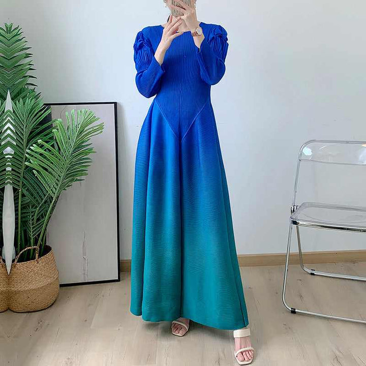 Long sleeve gradient color dress with flowing design and puffed shoulders, suitable for all occasions.