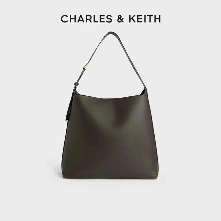 Minimalist CHARLES & KEITH shoulder bag with wide adjustable strap and magnetic closure in dark brown color