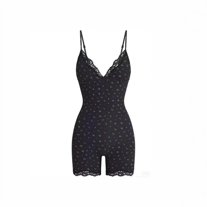 Black SKIMS short lace floral romper with thin straps and delicate small flower pattern