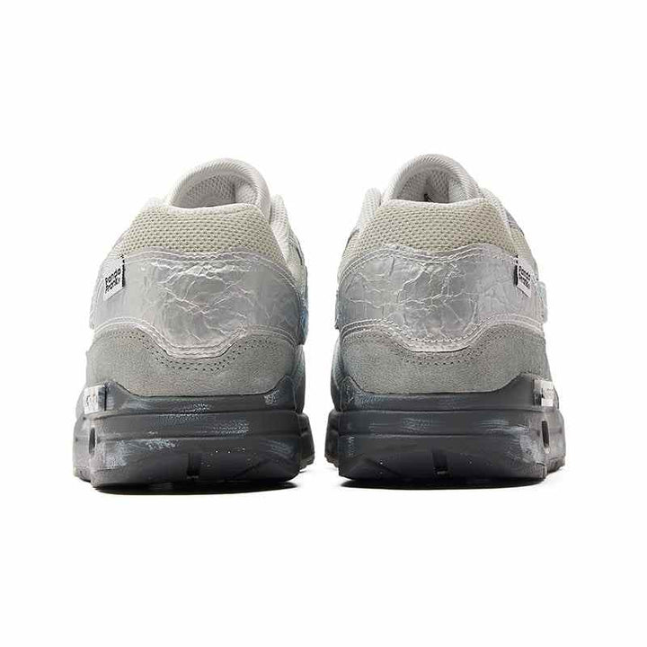 Classic Nike Air Max 1 sneakers with a unique, modern touch; features bold and subtle color blend, graphic details, and cushioned sole for all-day comfort.