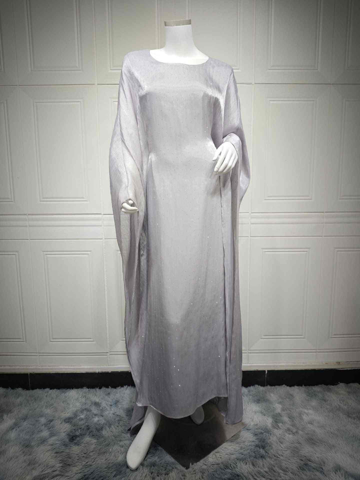 Elegant loose-fitting robe with wide sleeves, adorned with sparkling crystals, ideal for formal occasions.