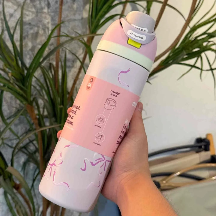 Owala FreeSip Cute Edition pink and white leak-proof water bottle with dual sip spout and playful design