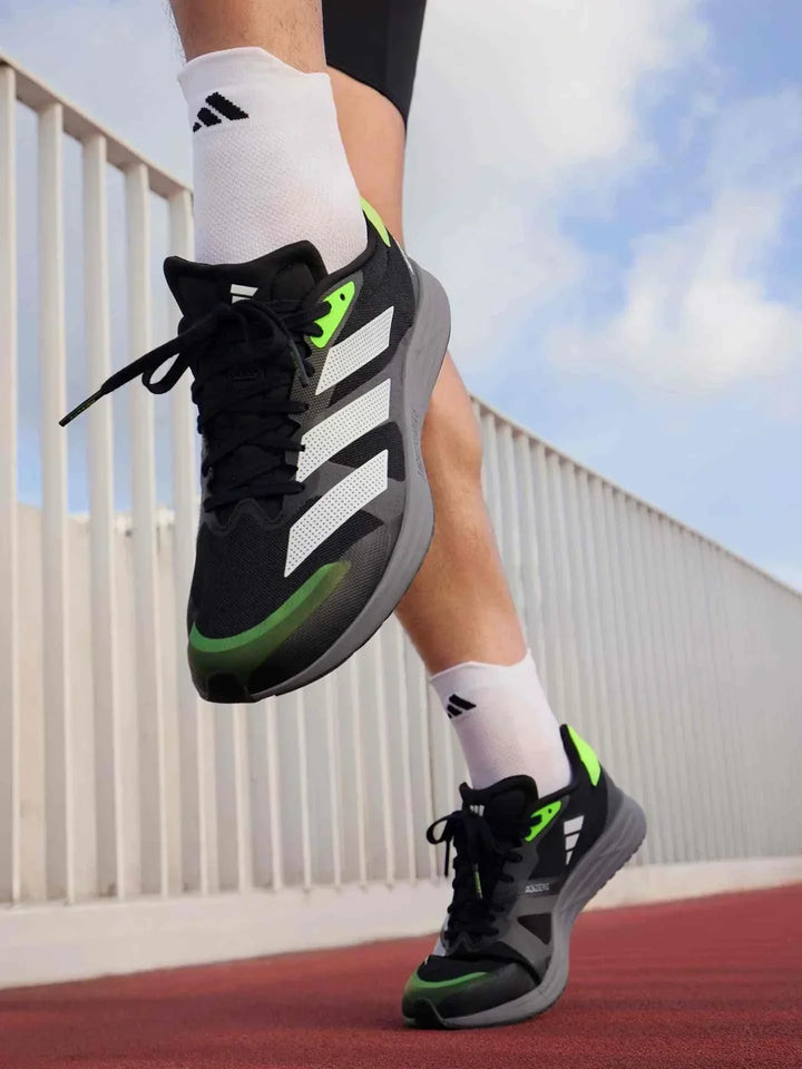 حذاء Adidas | أديداس Adizero RC 4 للجري والتدريب بتصميم خفيف الوزن ونعل متوسط ناعم الاستجابة وألوان ديناميكية