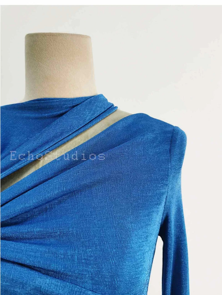 blue long sleeve evening maxi dress with draped detail on mannequin