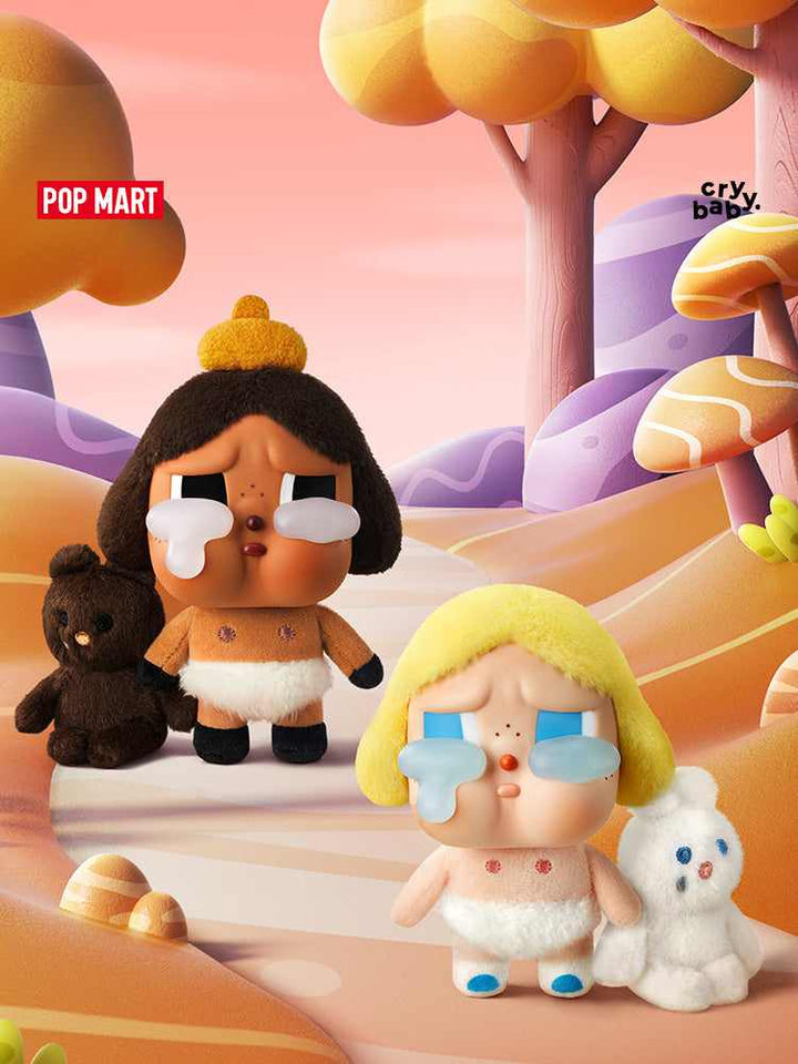 POP MART Crybaby plush toys with crying expressions in a whimsical landscape.