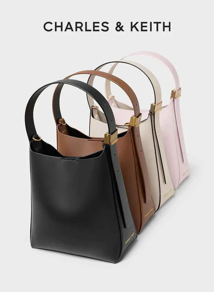 Small shoulder bags with matching wallets from CHARLES & KEITH in black, brown, beige, and pink colors with gold details