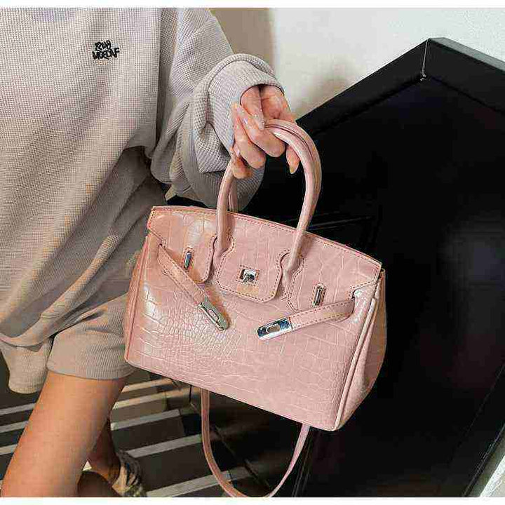 Pink Birkin-style women's handbag with crocodile pattern and high-quality leather texture