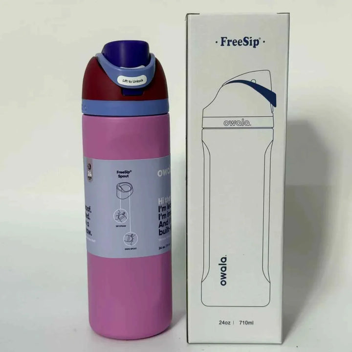 Owala FreeSip pink stainless steel water bottle with dual spout and leak-proof design next to its packaging box