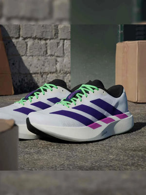 Adidas | أديداس حذاء جري فائق الخفة بتصميم سباق للرجال والنساء.