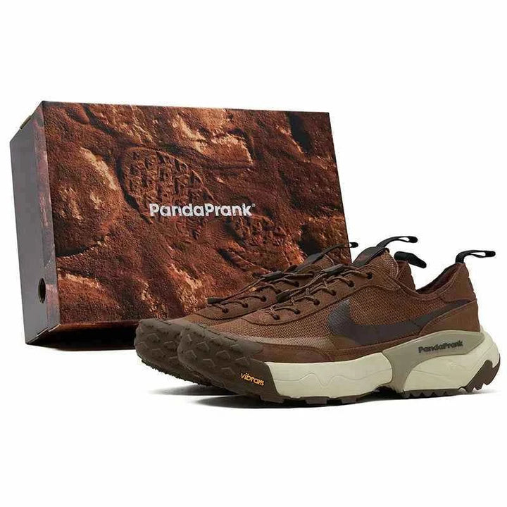 Brown Nike × PandaPrank Pro Trekking System hiking shoes with Vibram sole and Quicklace next to brown textured PandaPrank box