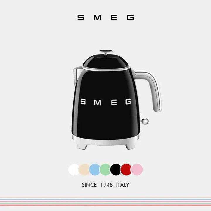 Compact SMEG electric kettle in black with Italian design, 0.8L capacity, heat-resistant handle, and stainless steel V-shaped spout.