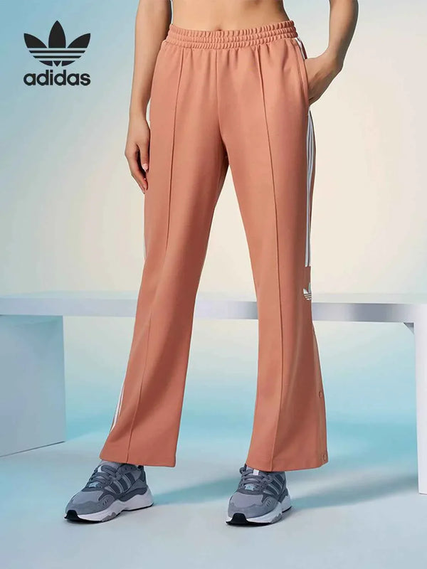 أديداس Adidas wide-leg original pink sports pants with classic three stripes and elastic waistband for comfort and casual style