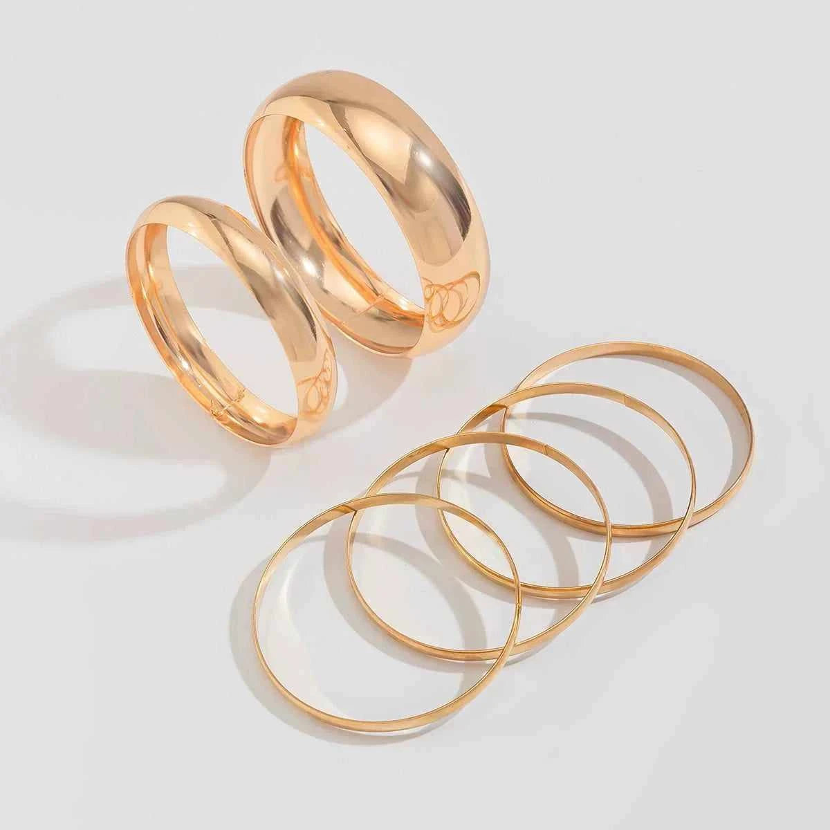 Metallic glossy curved bracelet | مجموعة سوار معدني لامع منحني موضة 2025.
