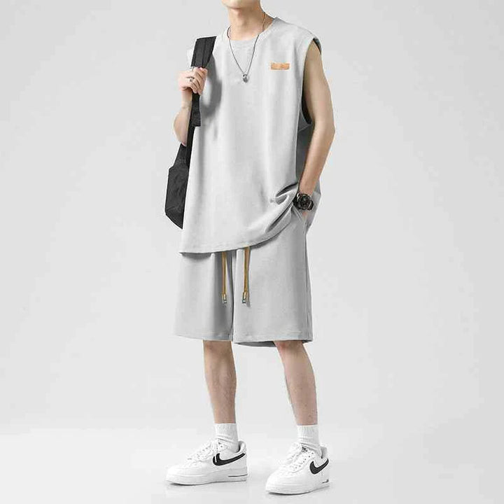 Men's Ice Silk loose t-shirt and practical shorts set in light grey with adjustable waist drawstring.
