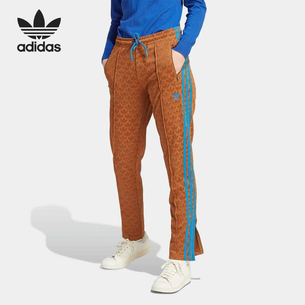 أديداس Adidas brown pants with blue stripes and unique patterned design for casual and sportswear