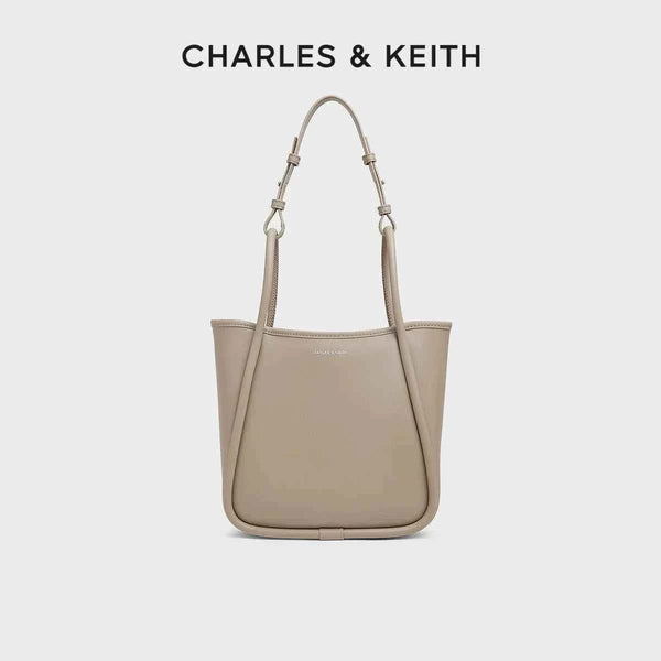 CHARLES & KEITH beige multi-color shoulder bag with adjustable straps and durable synthetic leather design