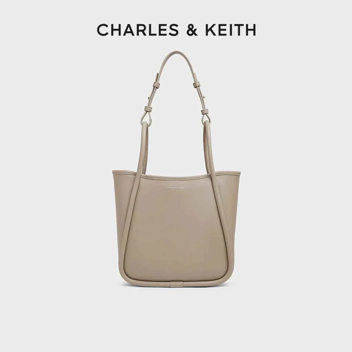 CHARLES & KEITH beige multi-color shoulder bag with adjustable straps and durable synthetic leather design