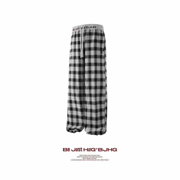 wide checkered pants in black and white with elastic waistband and drawstring for comfortable fit, casual loose fit بنطال كاروهات واسع