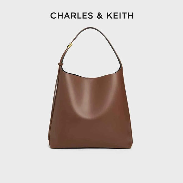 brown CHARLES & KEITH shoulder bag with wide adjustable strap and magnetic closure