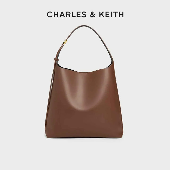 brown CHARLES & KEITH shoulder bag with wide adjustable strap and magnetic closure