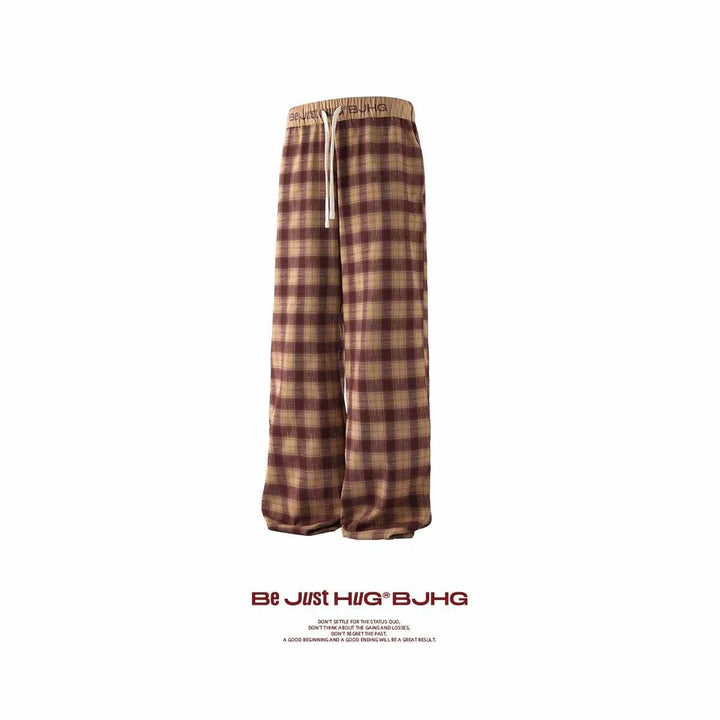 Wide brown and beige checkered pants with drawstring waist, comfortable loose fit بنطال كاروهات واسع