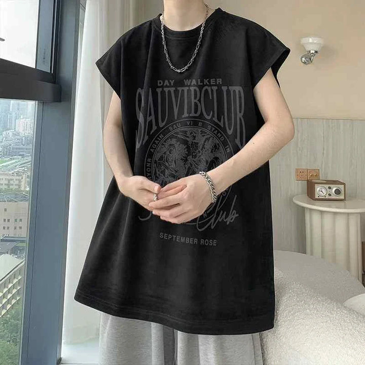 Black sleeveless SAUVIBCLUB t-shirt with graphic print worn with silver chain necklace