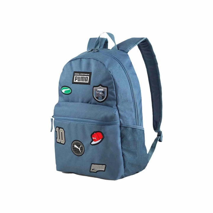 Blue Puma durable and spacious backpack with sporty patches and double zipper closure, ideal for school and casual use.