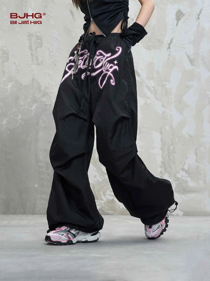 Black wide embroidered pants with BJHG logo, loose fit streetwear style.