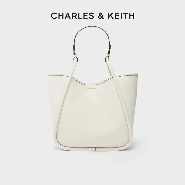 Large multicolor CHARLES & KEITH shoulder bag in soft cream faux leather with adjustable strap and spacious interior.