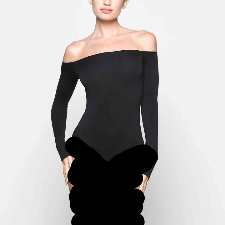 Off-shoulder long-sleeve SKIMS bodysuit in black.