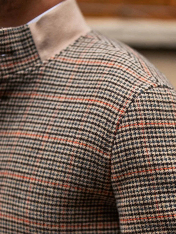 Mr. Lu San Fit Jacket close-up showing beige and brown houndstooth pattern with orange lines and stand-up collar