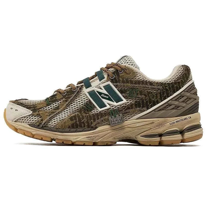 New Balance 1906R PandaPrank Wasteland Limited Edition shoe in earthy brown, beige, and dark green camo design with durable leather and mesh materials.