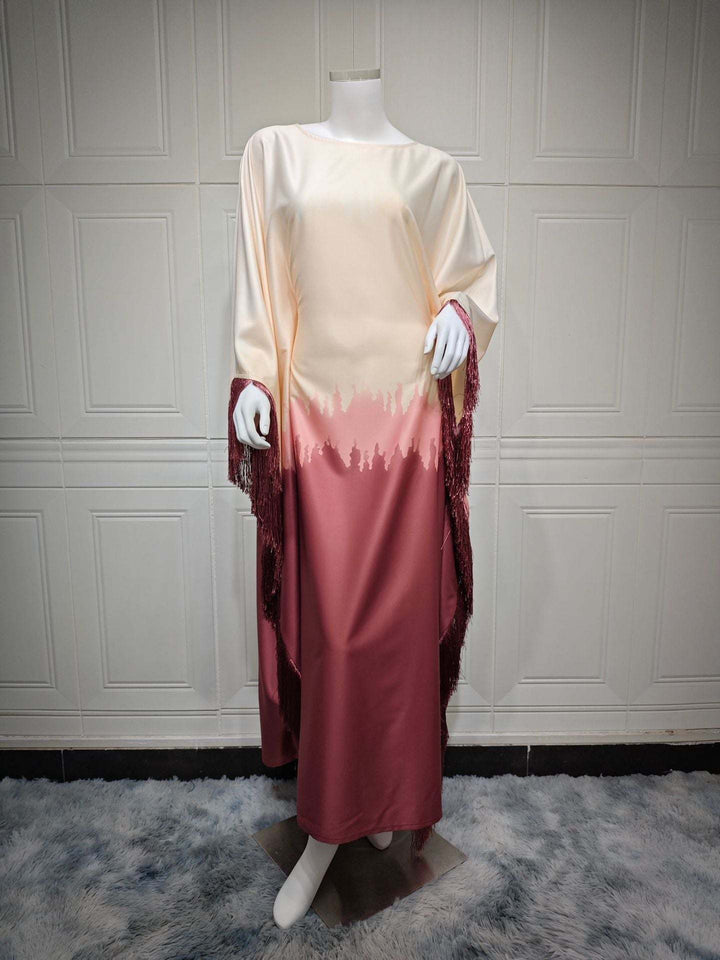 Elegant satin dress with gradient pattern and tassels on sleeves; perfect for luxurious occasions.