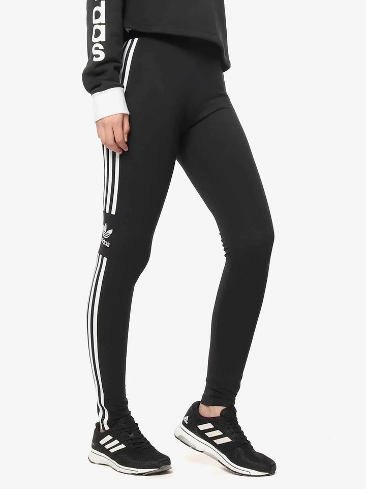 Black Adidas leggings with iconic three white stripes, slim fit, flexible fabric, and original Adidas logo for sporty and casual wear