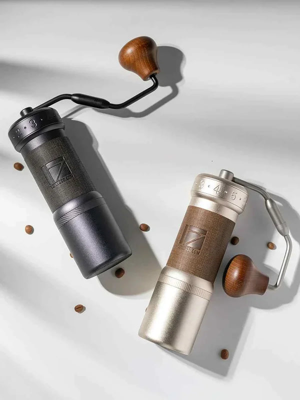 1zPresso K-Ultra Black manual coffee grinder with wooden handle and adjustable conical steel burrs.
