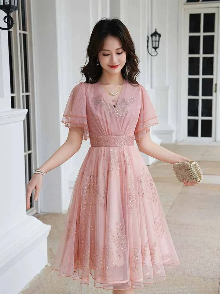 Elegant pink sequin-embellished Korean party dress with short sleeves, perfect for summer events.