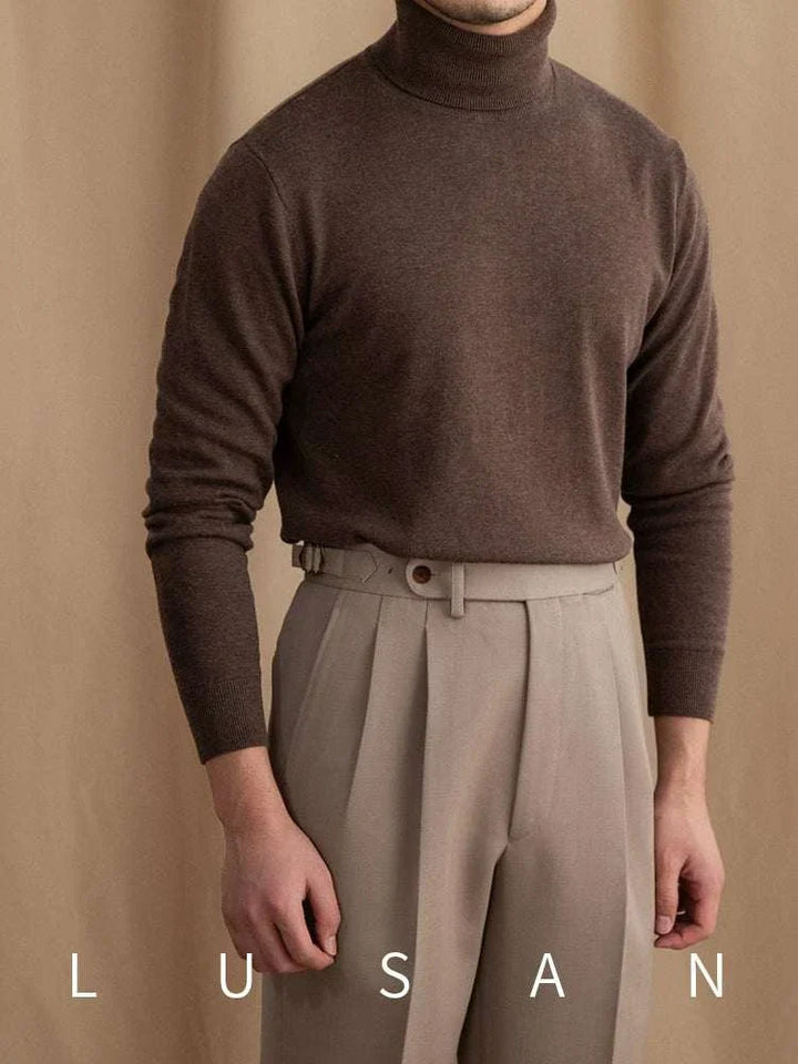 Mr. Lusan British brown turtleneck sweater with soft knit fabric and ribbed cuffs styled with beige trousers
