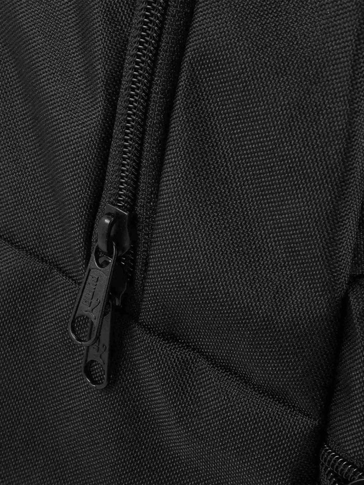 close-up of black durable fabric with dual zipper design on PUMA backpack
