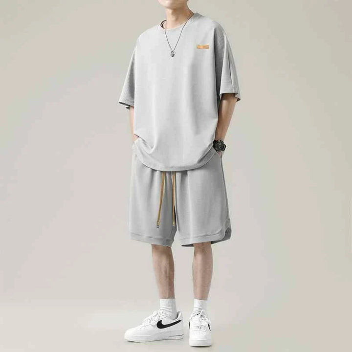 Men's Ice Silk set with loose T-shirt and practical shorts in light gray for summer comfort and style
