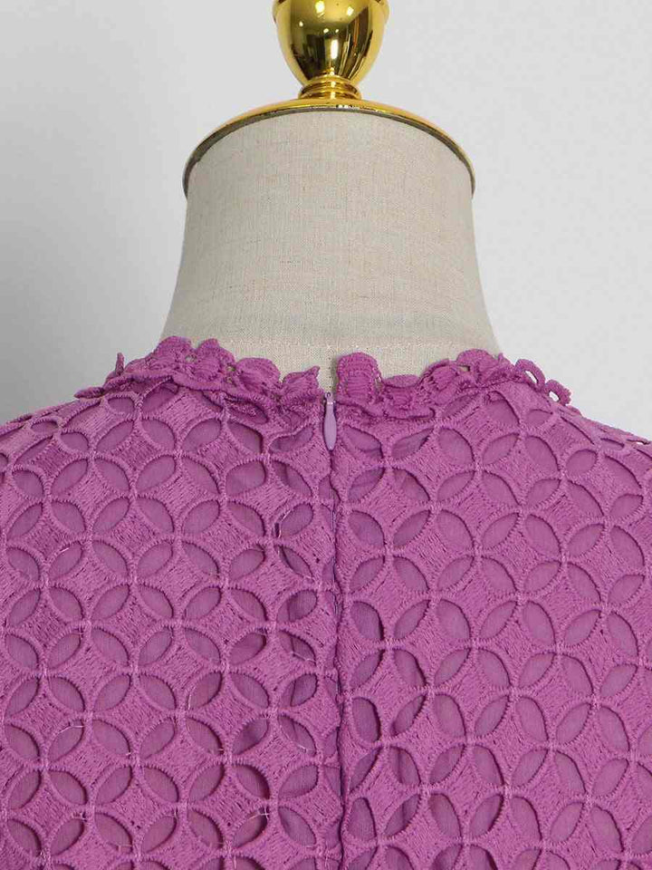 Luxurious lace dress with geometric pattern in romantic purple, featuring elegant long sleeves and delicate neckline detail.