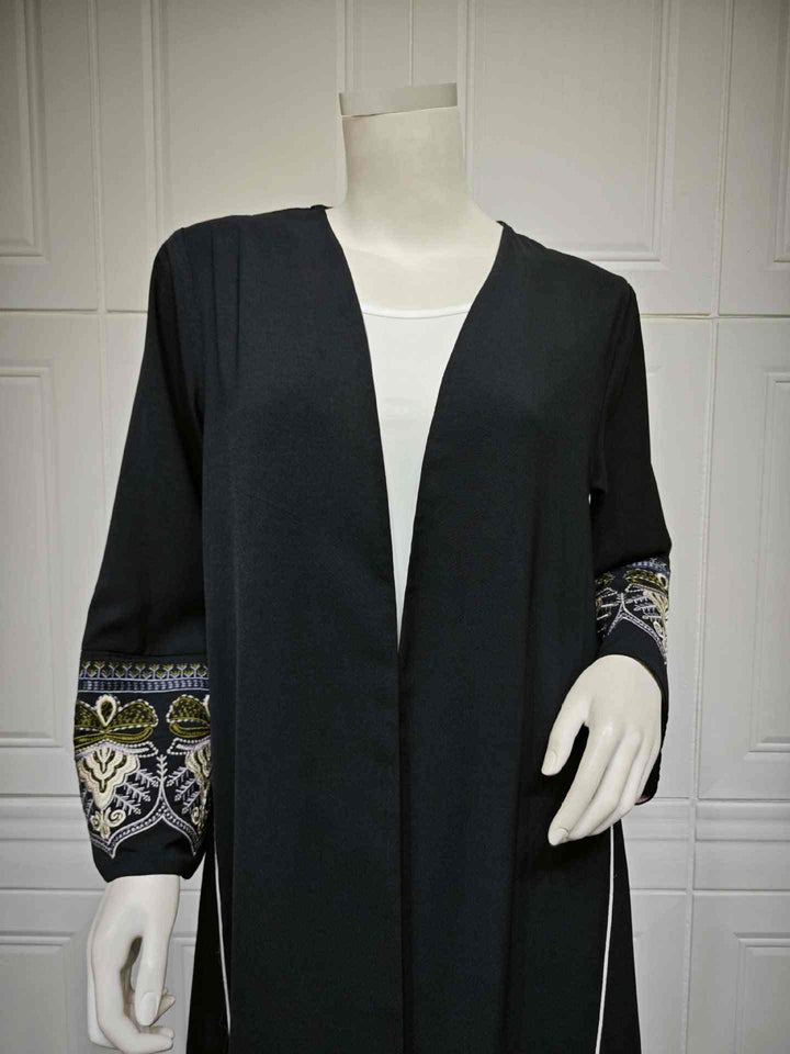 Black Abaya with embroidered sleeves, luxury design with golden details, elegant Muslim fashion for spring and summer.