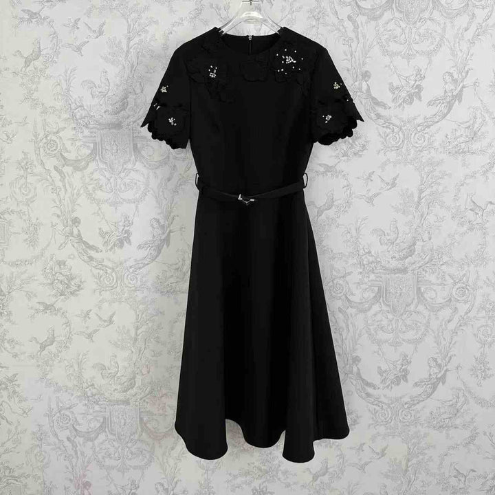 Royal floral dress with lace sleeves and elegant design in black.